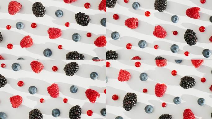 新鲜的覆盆子，黑莓，蓝莓，红醋栗在孤立的白色背景上旋转。健康的水果浆果。新鲜水果小吃。维生素K夏季概