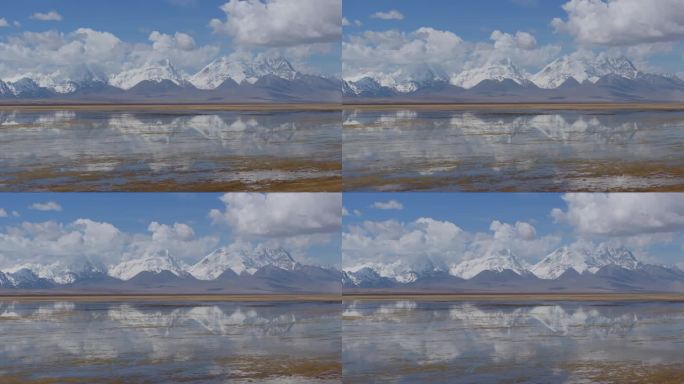 航拍西藏日喀则多情错和卓木拉日雪山