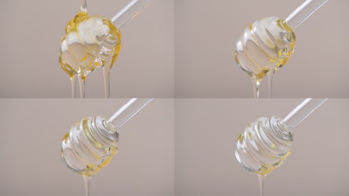 蜂蜜流下升格缓慢流入透明液体搅拌棒流下