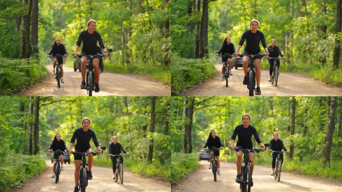中年妇女和她十几岁的女儿在阳光明媚的早晨在森林里骑自行车，骑自行车
