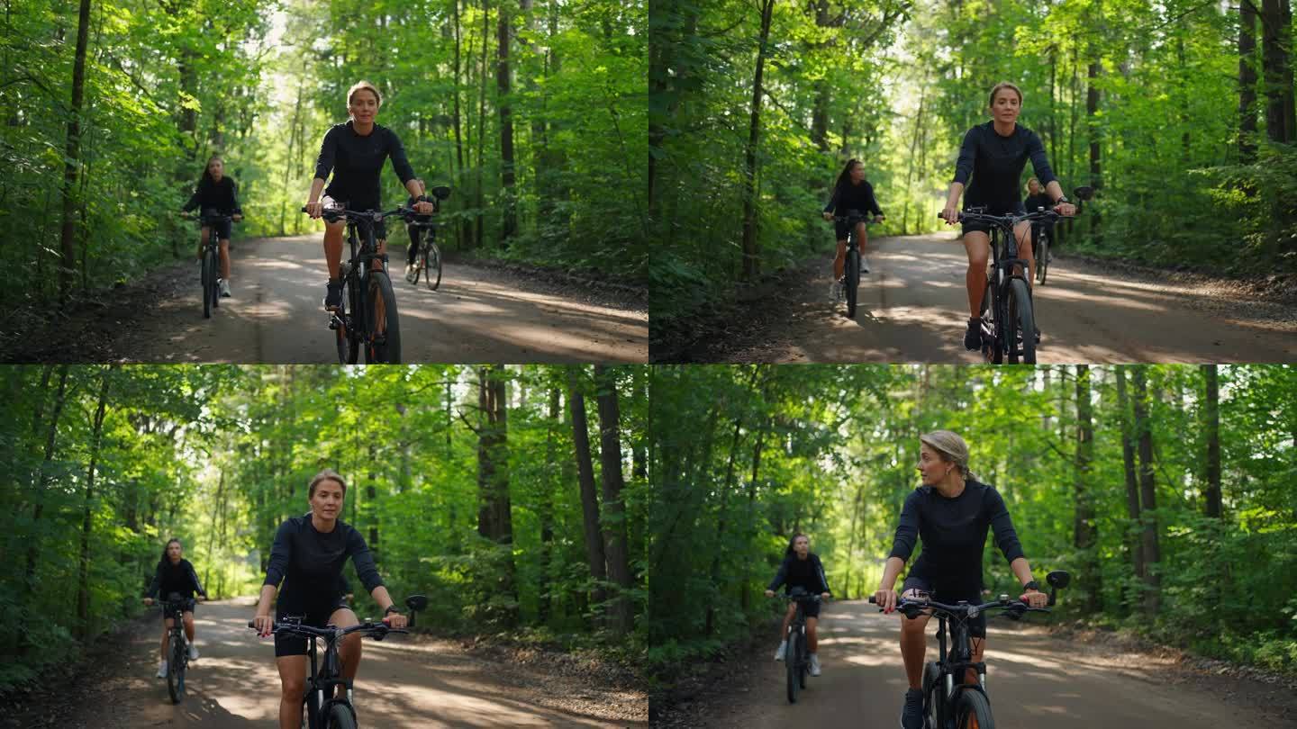 夏日周末骑自行车，三个女人在阳光明媚的日子里享受大自然和好天气