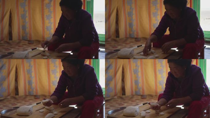 近距离拍摄蒙古包里制作传统食品Buuz的蒙古妇女