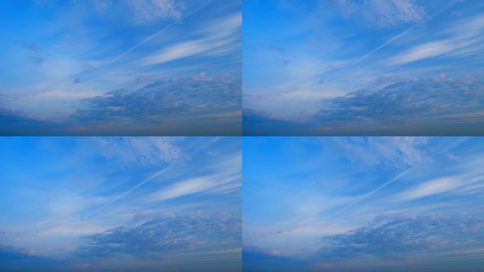 高云，暮时。不同色调的云越过渐暗的蓝色地平线。间隔拍摄。