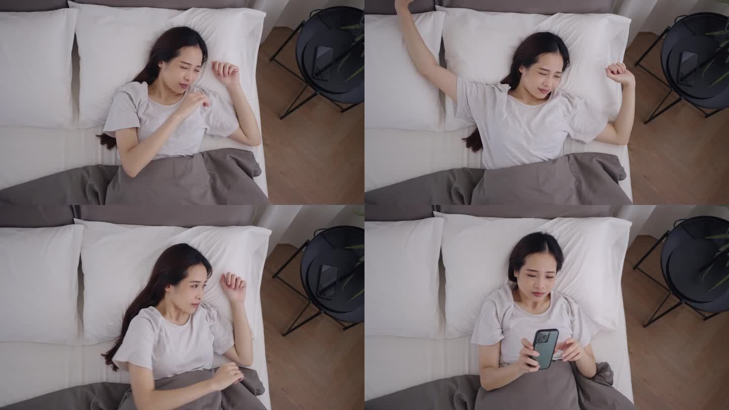 一个亚洲女人醒了周末自然醒伸懒腰白色床单