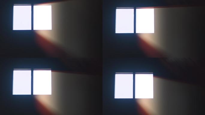 窗户在黑暗的房间4K与光线。