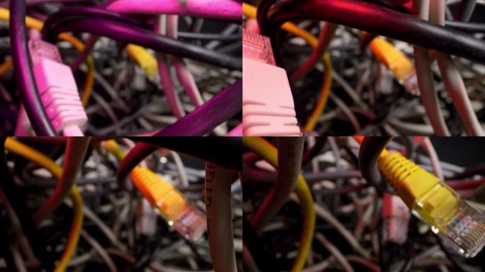 摄像机镜头穿过错综复杂的网线和其他障碍物。拆散的电线和电脑问题形成了一个混乱的场景。
