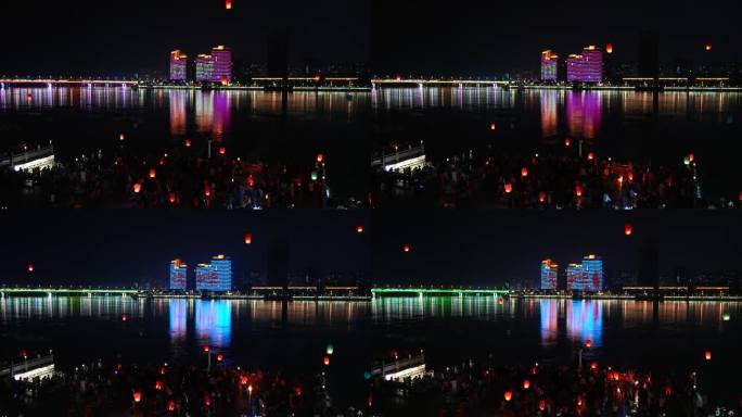 湖北襄阳江滩节假日放飞孔明灯祈福的人群