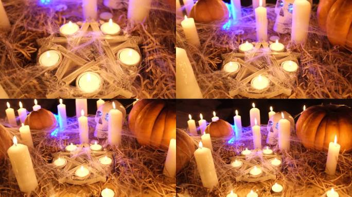 传统的南瓜，神秘的五角星，燃烧的蜡烛和蜘蛛网中的老骷髅，在干草中