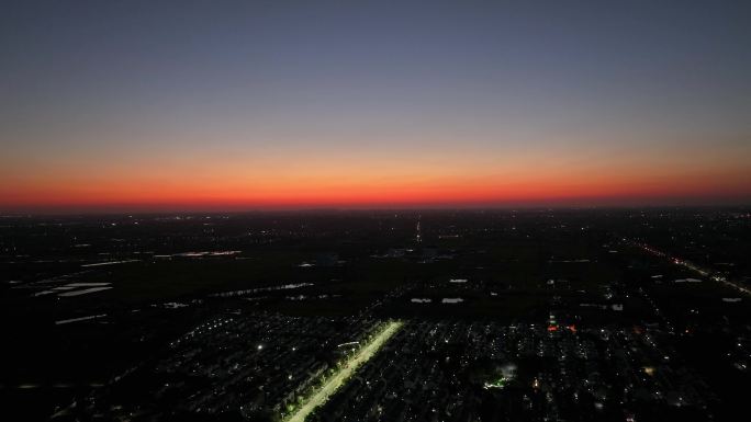 航拍农村乡镇夕阳落日街道灯光