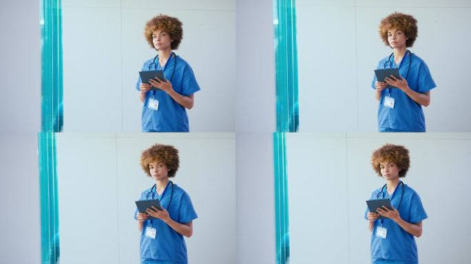 一名表情严肃的女医生在医院里戴着电子平板电脑