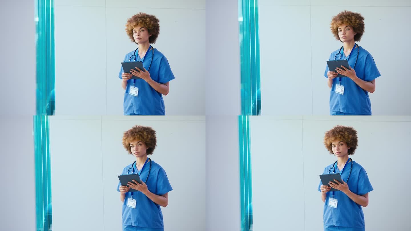 一名表情严肃的女医生在医院里戴着电子平板电脑