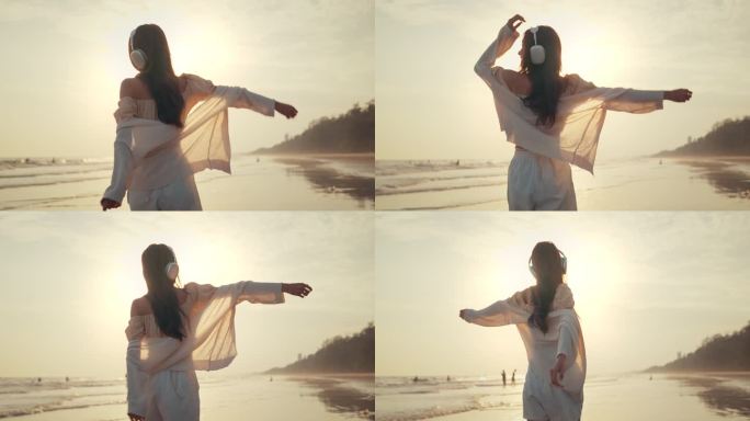 放松的亚洲女人戴着耳机走在海边的金色日落-女游客听音乐在暑假