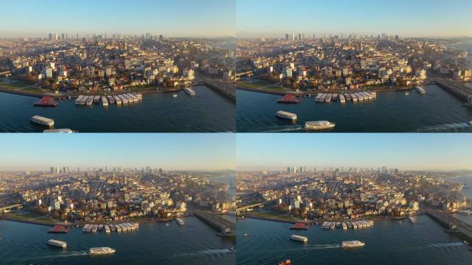 日落时分，无人机在远离加拉塔的海面上拍摄视频。海陆空交通鸟瞰图。伊斯坦布尔,土耳其。