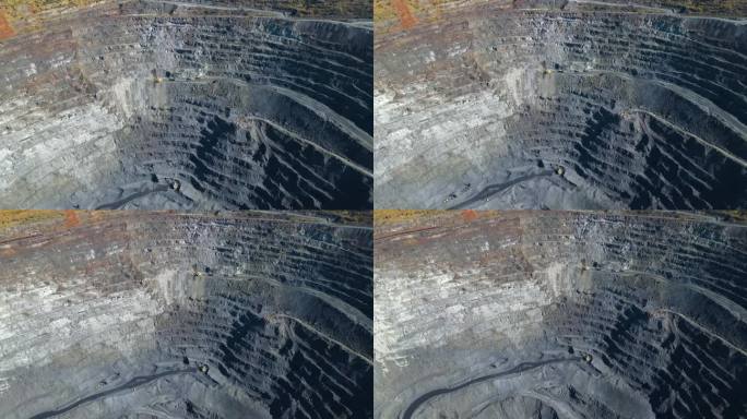 采石场铁矿开采采石场采石场卡车冶金生产巨坑顶视图无人机飞行