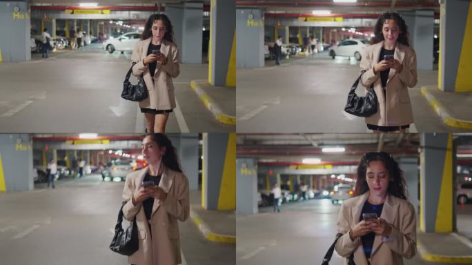一名女子在停车场走向她的车时看着她的智能手机