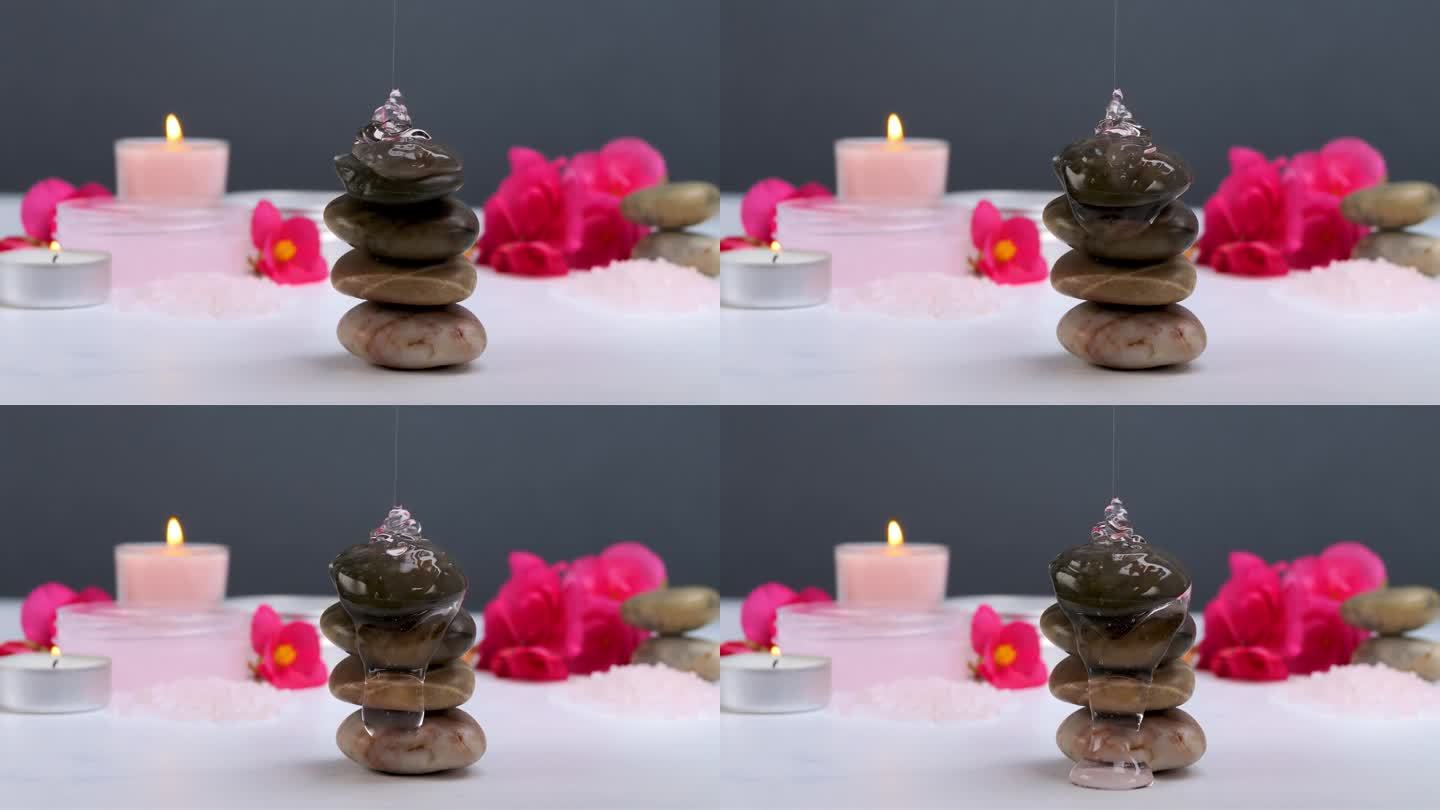 沐浴露流在温泉石与身体护理产品和蜡烛