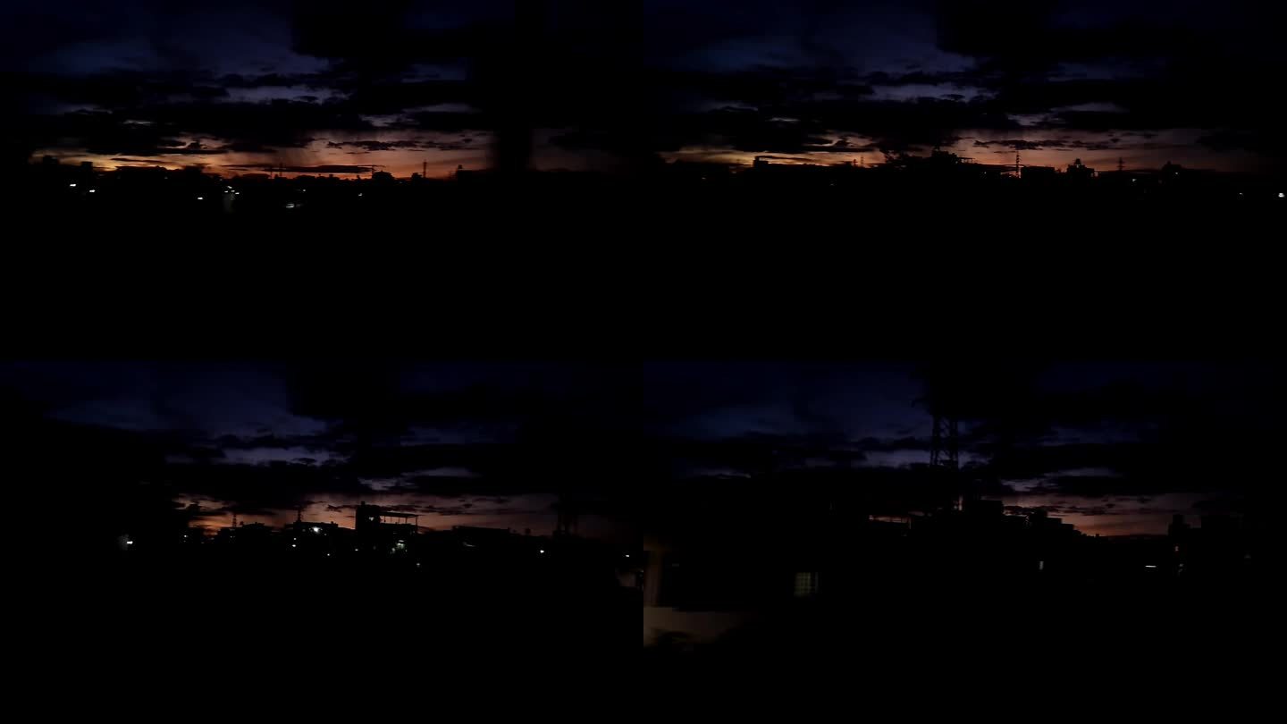 从高速行驶的火车上看到的城市上空黑暗日落的壮丽景色