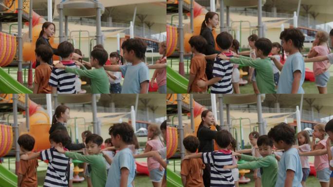 一群健康的孩子在夏日操场上与老师一起玩耍。