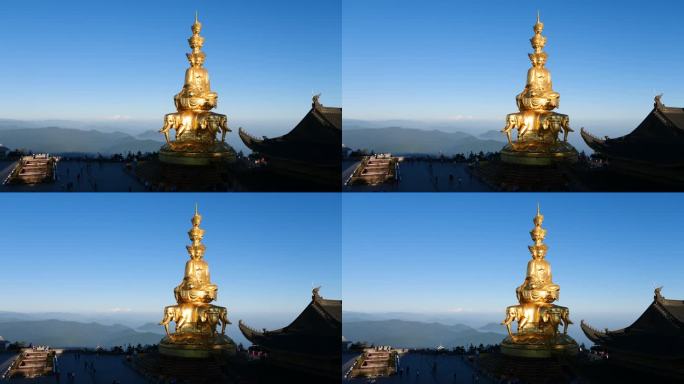在晴朗的日子里，游客在峨眉山山顶祈祷的剪影，金色的蒲仙佛像以贡嘎雪山为背景的4k延时镜头。