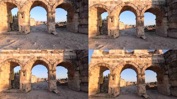 在德尼兹利的Pamukkale，日落时分的Frontinus门和古老的赫拉波利斯遗址广场