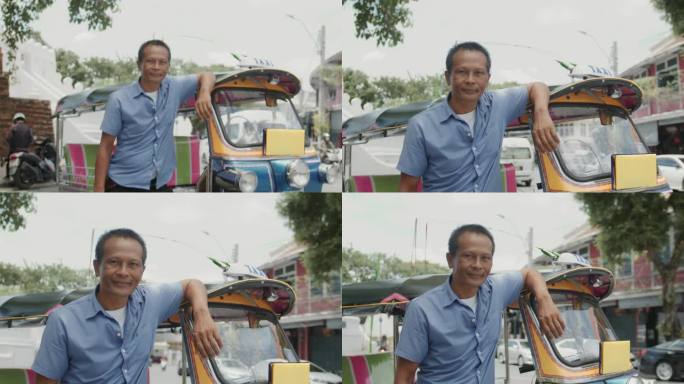 嘟嘟车司机和他的车站在曼谷老城区的道路上的肖像。