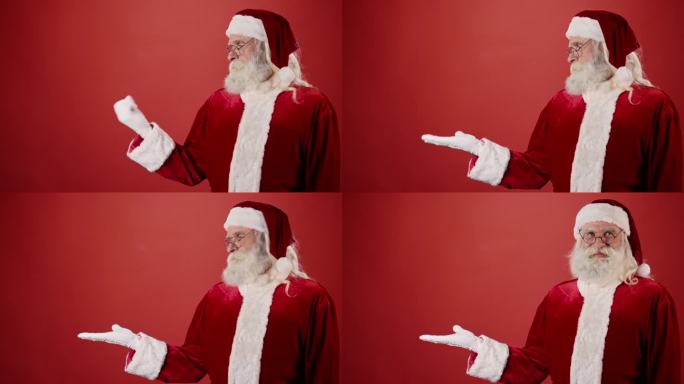微笑的圣诞老人伸出手拿东西，红色背景