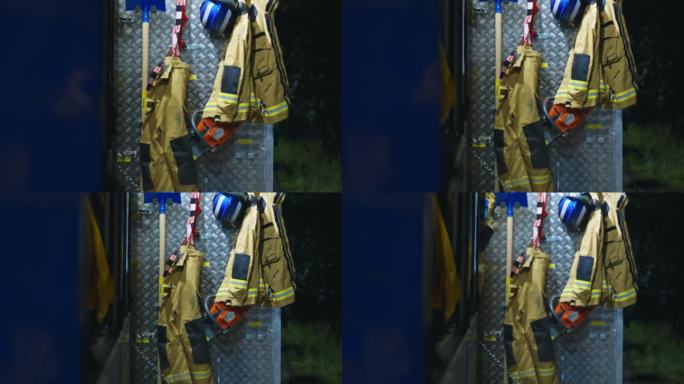 消防局消防车门上悬挂的消防制服及装备