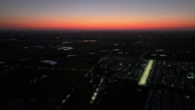 航拍农村乡镇夕阳落日街道灯光