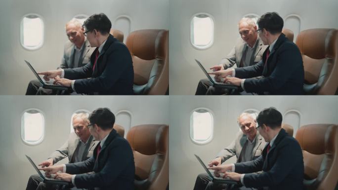 商务旅客乘飞机旅行时在笔记本电脑上工作。