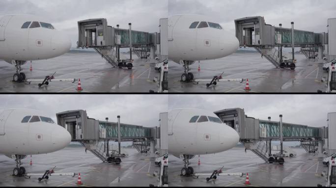 机场地勤人员用喷气桥连接机场大门和飞机入口