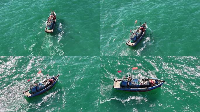 航拍威海湾里拖网捕捞的单拖渔船