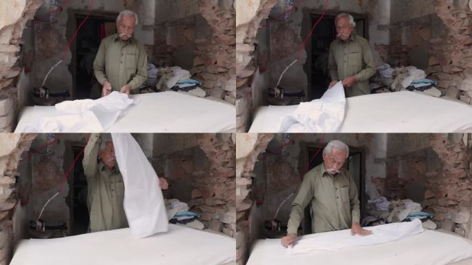 印度老人在熨衣服服饰裁缝贫民平民战后恢复