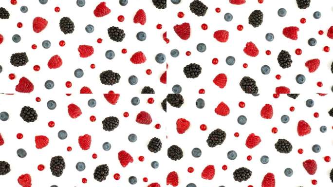 新鲜的覆盆子，黑莓，蓝莓，红醋栗在孤立的白色背景上旋转。健康的水果浆果。新鲜水果小吃。维生素K夏季概