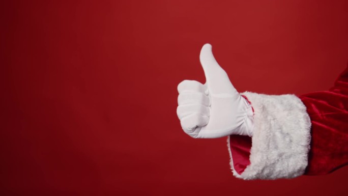 匿名圣诞老人伸出手，举起拇指，红色背景