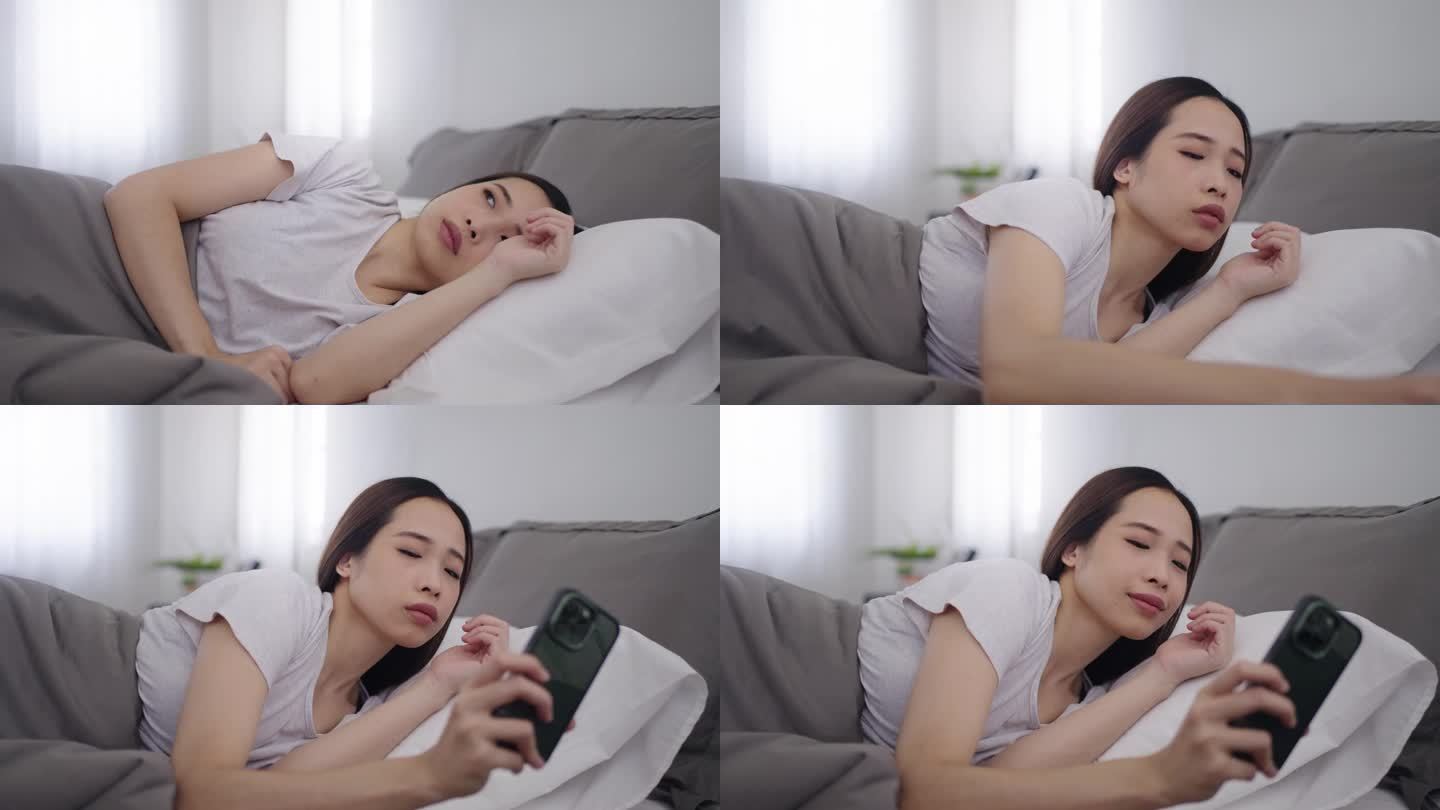 一个亚洲女人醒了美女睡醒看手机视频素材