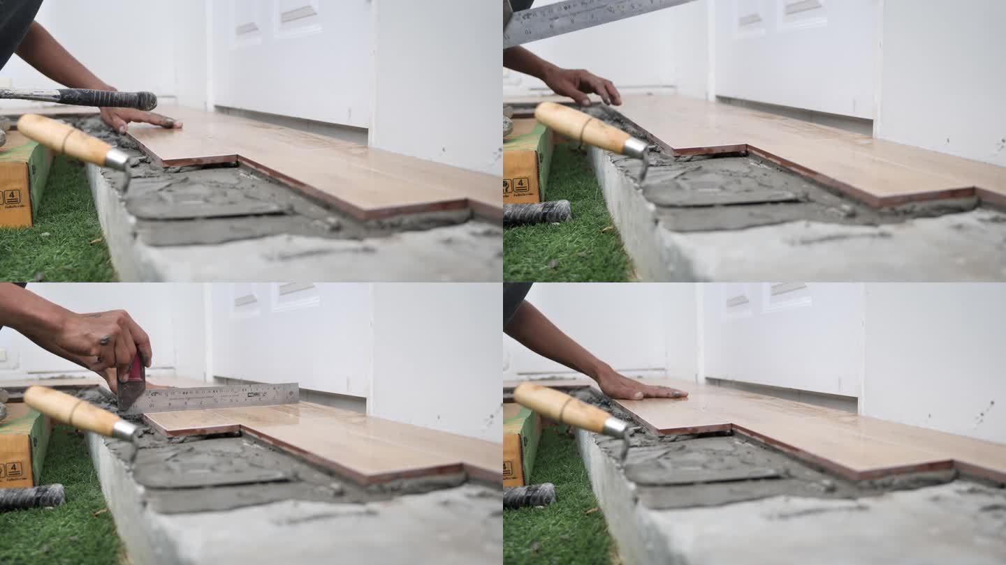 木匠在新装修的房子里安装木地板时很小心。