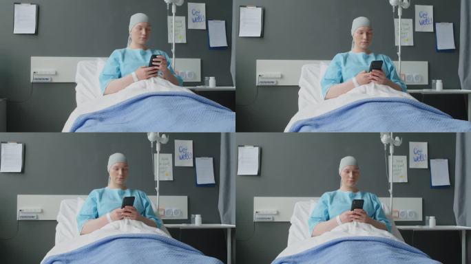 用智能手机在病房休息的肿瘤科年轻病人