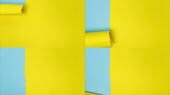 视频横幅与破纸。抽象撕纸视频在黄色和蓝色与复制空间。撕开的纸与蓝色背景文字的空间。