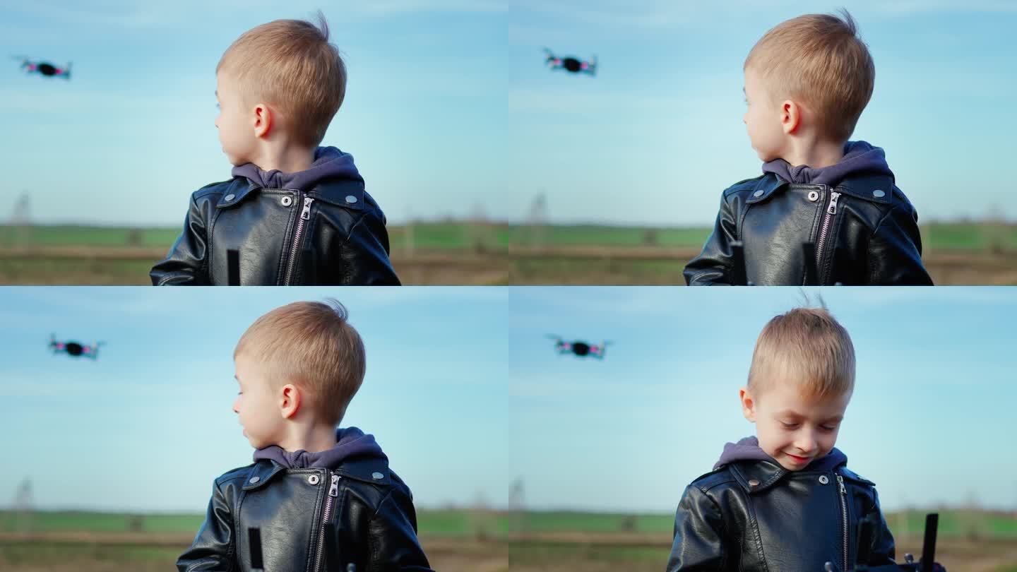 快乐的男孩在大自然中玩无人机。孩子用遥控器控制无人机。