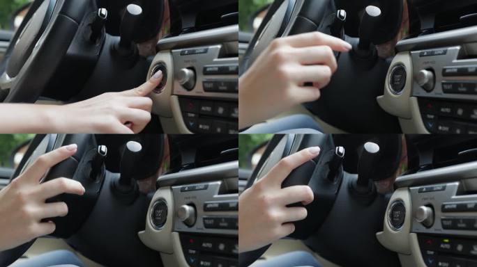 手按汽车启停按钮。