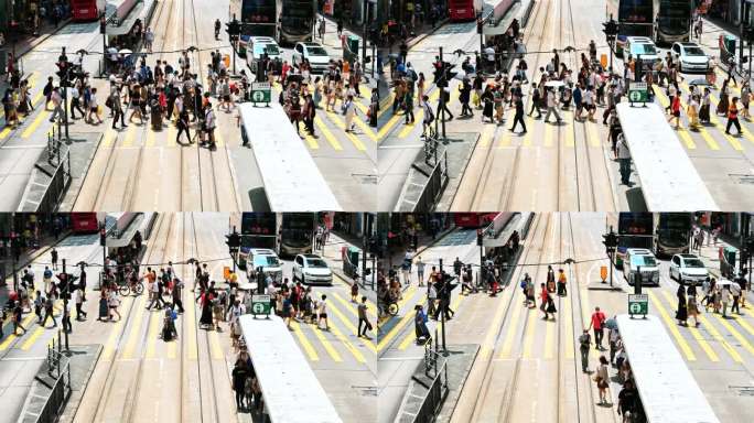 在香港铜锣湾购物区，游客走过斑马线。