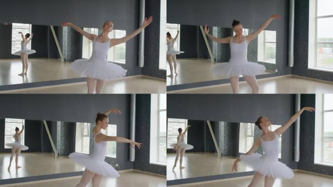 穿着芭蕾舞服的年轻女子在舞蹈室里挥舞着手臂跳舞