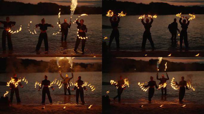 夏夜河滩上的火焰表演，手持火把的年轻女子剪影