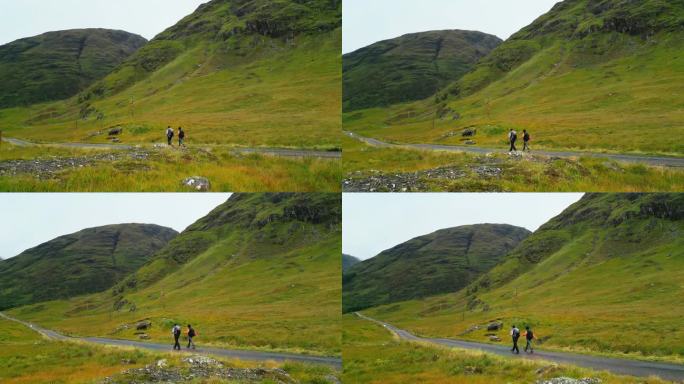 两个人一起用北欧拐杖徒步旅行。爬上一个巨大的岩田
