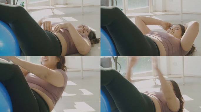 胖胖的亚洲女人在做运动。