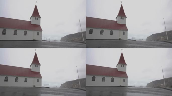 Vík í Mýrdal阴天冰岛海岸线上山上的乡村教堂