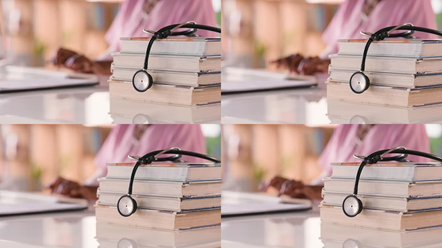 学生，医学听诊器和书籍放在桌子上学习，教育和医学知识。从事医疗保健研究、护士奖学金或攻读博士学位、心