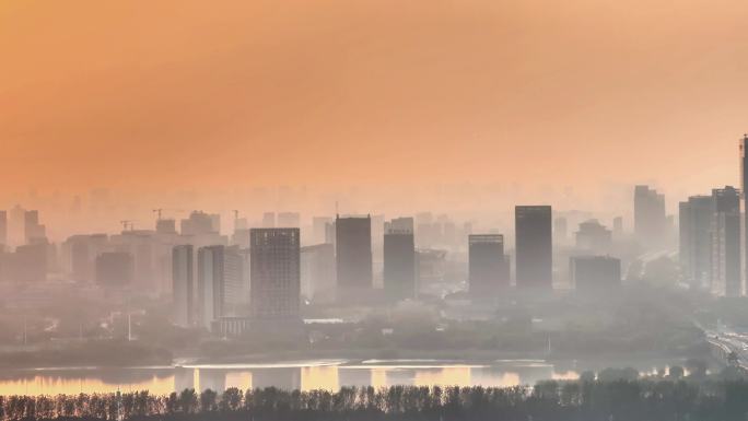 航拍夕阳高铁行驶桥梁河流车流建筑群高楼