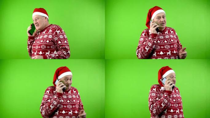 戴红色圣诞帽，穿着圣诞毛衣的老人一边走一边打电话。
