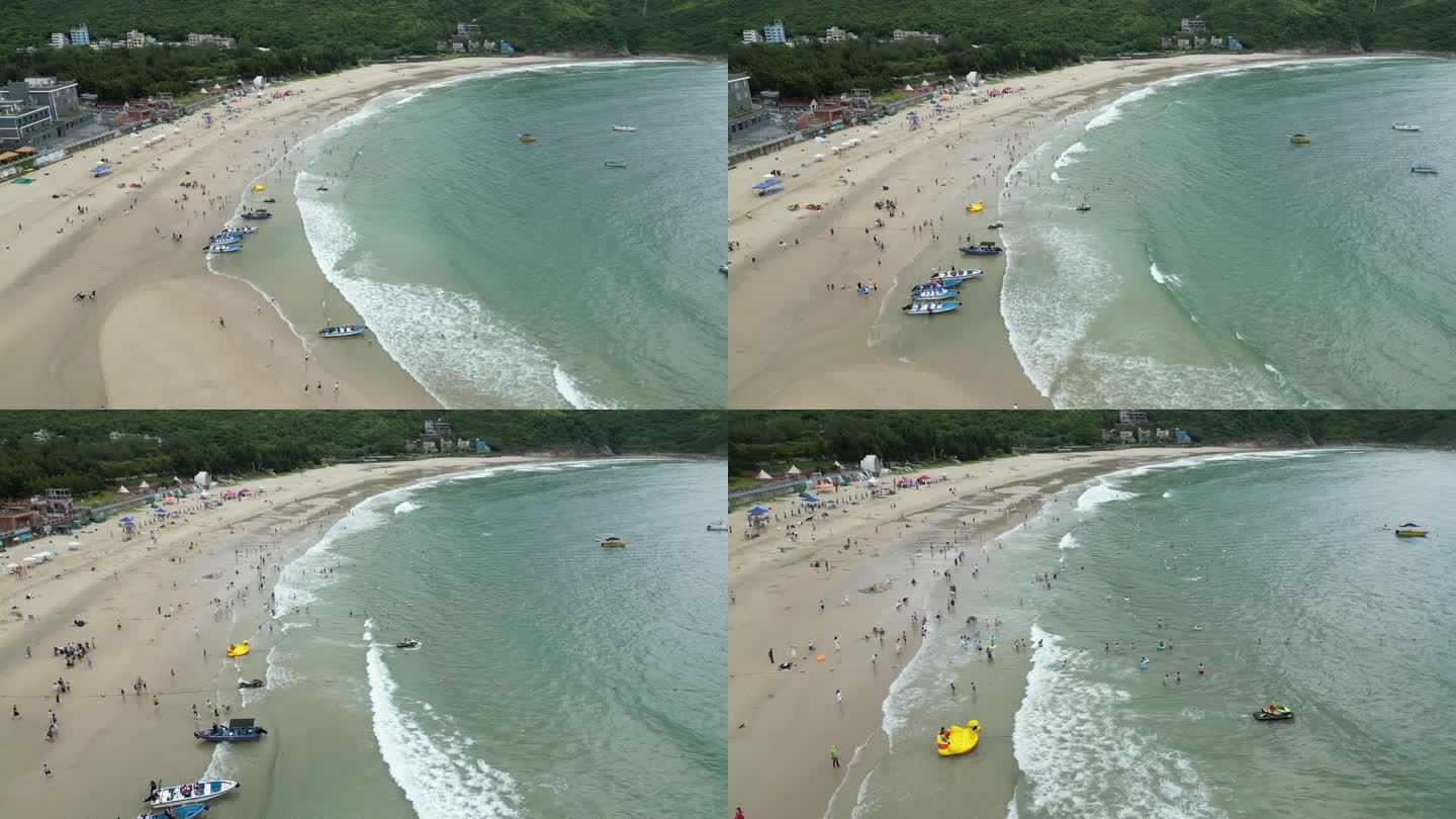 深圳西涌景区沙滩游玩人群航拍